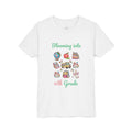 Floral school supplies collage design reading Blooming into grade, with personalized name, on white kids t-shirt