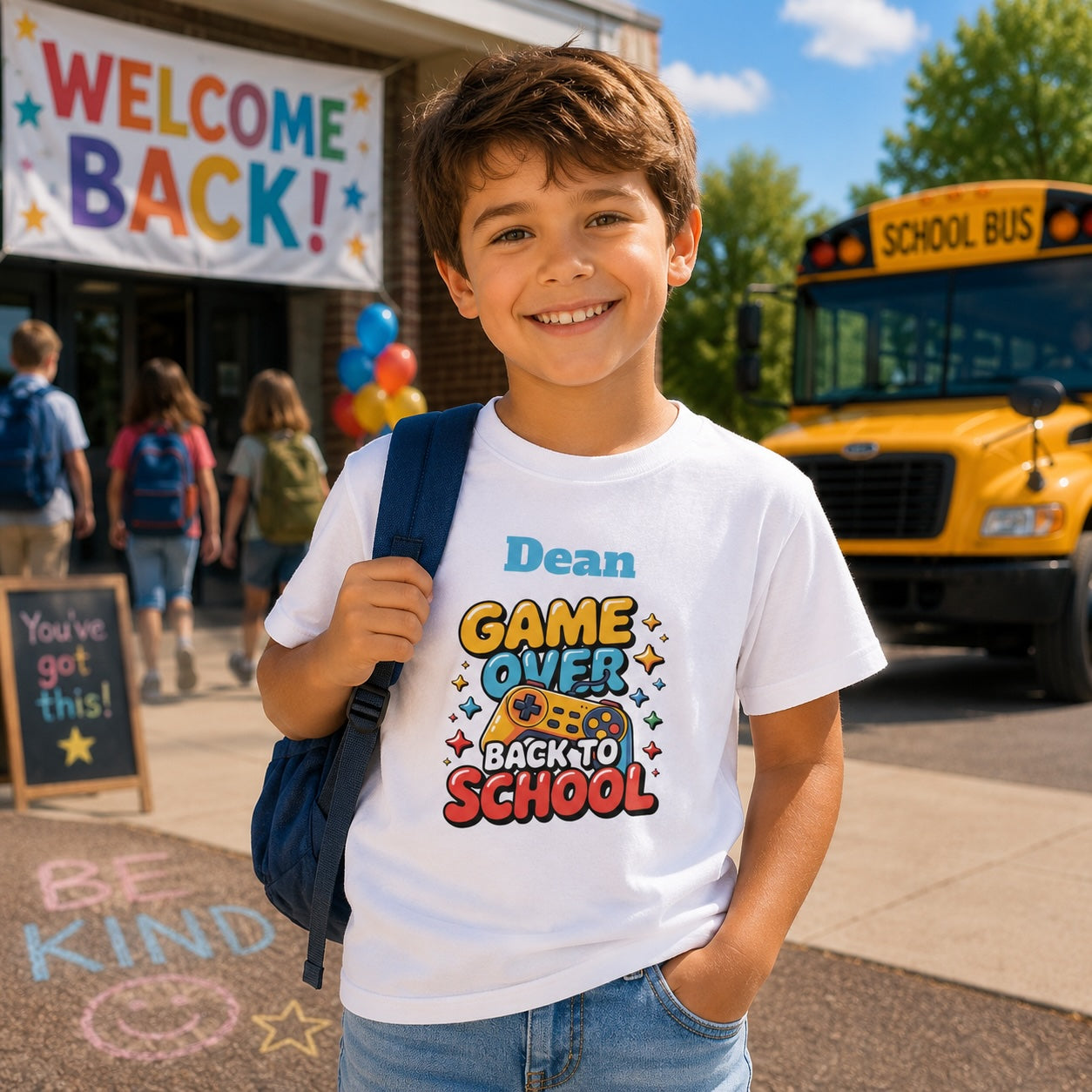 Child wearing personalized game over back to school t-shirt outside school with backpack and school bus