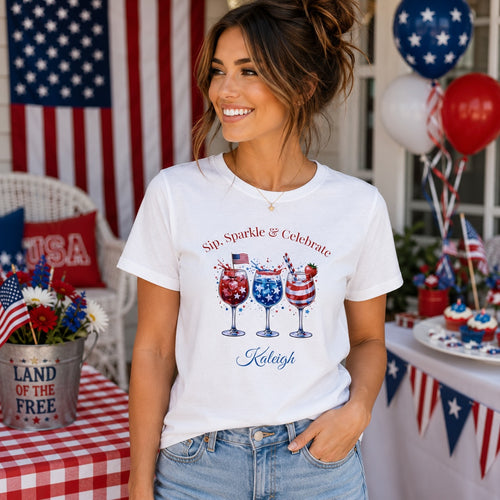 Personalized patriotic women's t-shirt mockup – Sip Sparkle & Celebrate tee with cocktail glasses design on white background